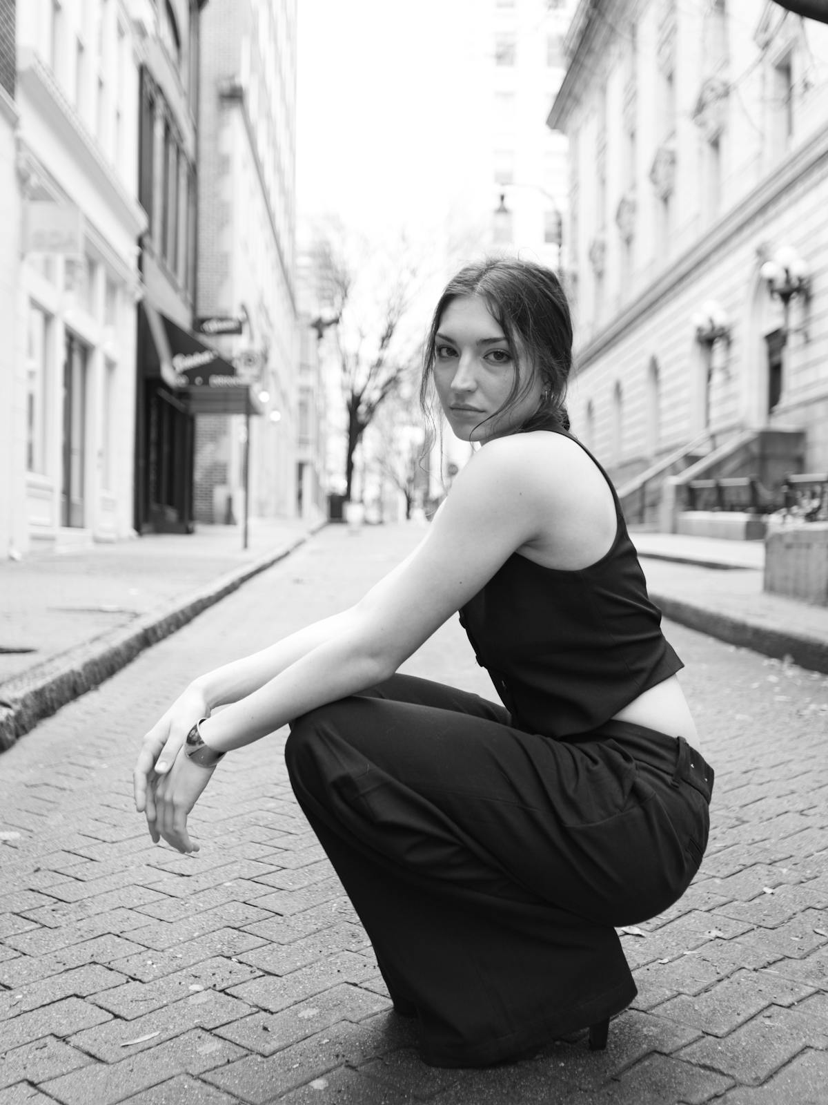 Urban black-and-white portrait, sharp tailoring.